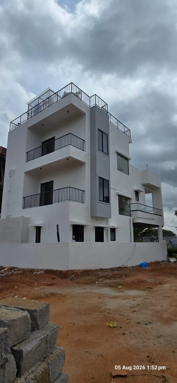 Vinny's Abode rear massing under cloudy sky